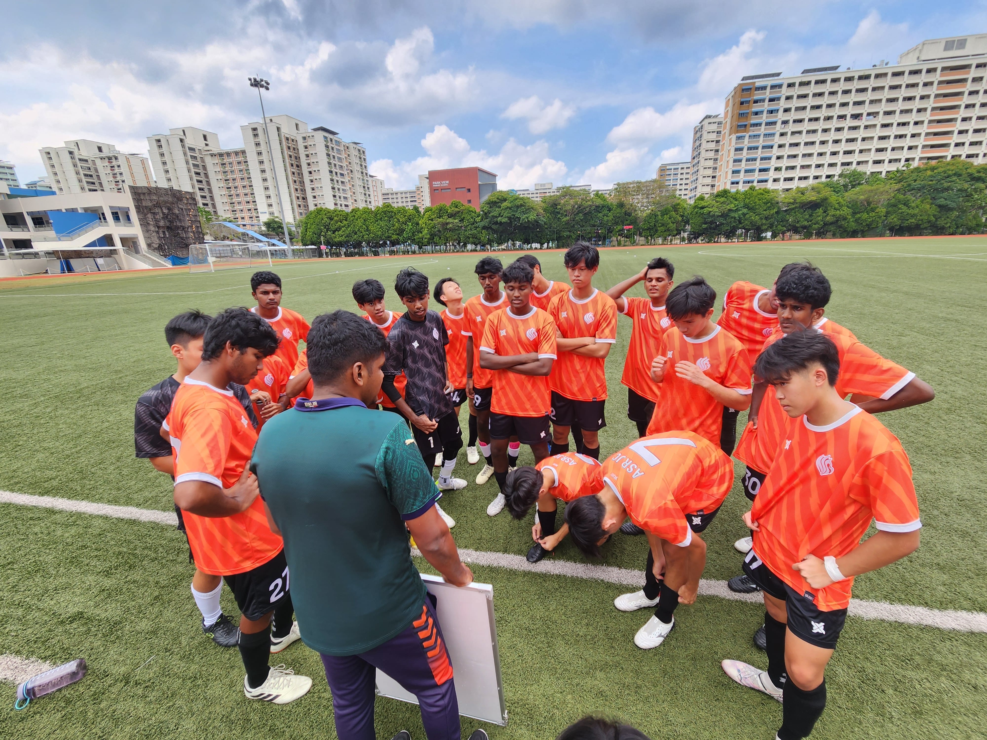 Football coach addressing the players